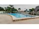 Enjoy the community pool with plenty of lounge seating and shade at 14130 Rosemary Ln # 3312, Largo, FL 33774