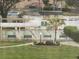 Well-maintained shuffleboard courts with benches and a landscaped flower bed offer a relaxing outdoor activity at 14130 Rosemary Ln # 3312, Largo, FL 33774