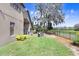 Spacious backyard features a well-maintained lawn, mature trees, and fence line at 15723 Starling Water Dr, Lithia, FL 33547