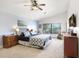 Inviting primary bedroom boasting a vaulted ceiling, ample natural light, and neutral color palette at 15723 Starling Water Dr, Lithia, FL 33547