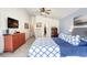 Spacious bedroom features a bed, dresser, and ensuite bath access; comfortable, and well-lit at 15723 Starling Water Dr, Lithia, FL 33547