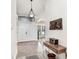 Inviting hallway with high ceilings, a chandelier and stylish decor at 15723 Starling Water Dr, Lithia, FL 33547