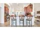Stylish breakfast bar with seating overlooking the kitchen and the rest of the living space at 15723 Starling Water Dr, Lithia, FL 33547