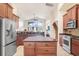 Spacious kitchen with a large island, stainless steel appliances, and access to the living area at 15723 Starling Water Dr, Lithia, FL 33547