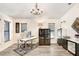 Bright home office with ample natural light, modern desk, and stylish decor at 15723 Starling Water Dr, Lithia, FL 33547