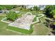 Aerial view of community skatepark featuring ramps, rails, and green spaces for outdoor recreation at 15723 Starling Water Dr, Lithia, FL 33547