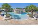 Community waterpark featuring pool, waterfall, slide, gazebo, lounge seating, and palm trees at 15723 Starling Water Dr, Lithia, FL 33547