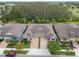 Charming single-Gathering home featuring a paved driveway, a two-car garage and lush landscaping near a wooded area at 16822 Balance Cv, Land O Lakes, FL 34638