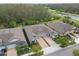 Charming single-Gathering home featuring a paved driveway, a two-car garage and lush landscaping near a main road at 16822 Balance Cv, Land O Lakes, FL 34638