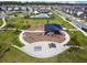 A bird's-eye view of the community amenities, including a playground, pool, and clubhouse at 16822 Balance Cv, Land O Lakes, FL 34638