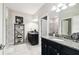 Well-appointed bathroom with granite countertops and modern fixtures and a shelf for storage at 16822 Balance Cv, Land O Lakes, FL 34638