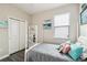 Cozy bedroom featuring a twin bed, wood floors and a closet at 16822 Balance Cv, Land O Lakes, FL 34638