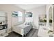 Charming bedroom featuring a twin bed, wood floors and natural light at 16822 Balance Cv, Land O Lakes, FL 34638