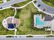Aerial view of the community playground, pool, and parking, offering many amenities for residents at 16822 Balance Cv, Land O Lakes, FL 34638