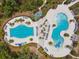 Aerial view of the neighborhood pool features a leisure pool and a lap pool surrounded by seating at 16822 Balance Cv, Land O Lakes, FL 34638