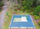 Aerial view of an outdoor exercise area featuring modern equipment on a blue cushioned surface at 16822 Balance Cv, Land O Lakes, FL 34638