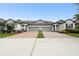 Inviting townhome with brick driveway, manicured lawns, and convenient two-car garages at 16822 Balance Cv, Land O Lakes, FL 34638