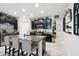Well-equipped kitchen with stainless steel appliances, granite countertops, and dark cabinetry for a sleek design at 16822 Balance Cv, Land O Lakes, FL 34638