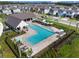 A refreshing pool with lounge chairs is surrounded by well-maintained landscaping and a sun deck at 16822 Balance Cv, Land O Lakes, FL 34638