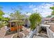 Landscaped backyard featuring a wooden gazebo with a charming outdoor space at 1700 Hunter Ln, Tarpon Springs, FL 34689
