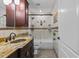 Beautiful bathroom with granite countertops, tiled shower and bath, and decorative mosaic accents at 1700 Hunter Ln, Tarpon Springs, FL 34689