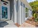 Inviting front entrance showcasing a unique door design and attractive exterior accents at 1700 Hunter Ln, Tarpon Springs, FL 34689