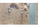 Shower with custom tile accents, glass door, and built-in shelving at 1700 Hunter Ln, Tarpon Springs, FL 34689