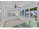 Cozy sunroom with decorative windows, bar top, and ample natural light at 1700 Hunter Ln, Tarpon Springs, FL 34689
