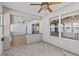 Beautiful sunroom with bar, multiple windows, and cozy decor at 1700 Hunter Ln, Tarpon Springs, FL 34689
