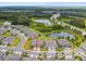 A high angle shot highlights a beautiful single-Gathering home, situated on a well-maintained lot with lush landscaping at 19370 Hawk Valley Dr, Tampa, FL 33647