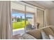 Backyard patio with outdoor seating and a view of the green, manicured lawn at 19370 Hawk Valley Dr, Tampa, FL 33647