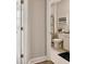Neat bathroom featuring a clean toilet, and a tiled shower for a simple and functional space at 19370 Hawk Valley Dr, Tampa, FL 33647