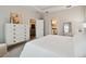 Comfortable bedroom with neutral colors, dresser, and access to the bathroom and living room at 19370 Hawk Valley Dr, Tampa, FL 33647