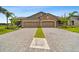 Beautiful paired villas feature brick accents, well-manicured lawns, and brick paver driveways at 19370 Hawk Valley Dr, Tampa, FL 33647
