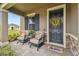 Inviting front porch with comfortable seating and stylish decor, creating a warm and welcoming entrance at 19370 Hawk Valley Dr, Tampa, FL 33647