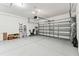 Spacious two-car garage with an epoxy floor and a paneled garage door at 19370 Hawk Valley Dr, Tampa, FL 33647