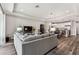 Open concept living room with hardwood floors, recessed lighting and views of the kitchen at 19370 Hawk Valley Dr, Tampa, FL 33647