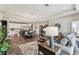 Open-concept living space with wood floors, neutral tones, dining area, and modern kitchen at 19370 Hawk Valley Dr, Tampa, FL 33647