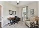 Well-lit office space with a cozy chair, providing a functional workspace with natural light at 19370 Hawk Valley Dr, Tampa, FL 33647