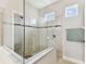 Modern shower with tile walls, glass enclosure, and ample space for a refreshing experience at 19370 Hawk Valley Dr, Tampa, FL 33647