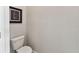 Neutral powder room with a toilet and modern decor, providing convenience for guests at 19370 Hawk Valley Dr, Tampa, FL 33647