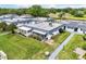 Bird's eye view displays home with a screened-in lanai, patio, and landscaped grounds at 205 Andover N Pl # 110, Sun City Center, FL 33573