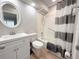 Cozy bathroom featuring a shower-tub combination and updated vanity at 205 Andover N Pl # 110, Sun City Center, FL 33573