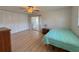 Bedroom with wood flooring, closet and natural light at 205 Andover N Pl # 110, Sun City Center, FL 33573