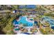 Stunning aerial view of the community pool and amenity center at 205 Andover N Pl # 110, Sun City Center, FL 33573