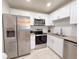 Modern kitchen with stainless steel appliances and granite countertops at 205 Andover N Pl # 110, Sun City Center, FL 33573