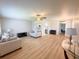 Spacious living room with modern flooring, ceiling fan, and neutral color palette at 205 Andover N Pl # 110, Sun City Center, FL 33573