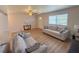 Bright and airy living room featuring wood-look floors and modern decor at 205 Andover N Pl # 110, Sun City Center, FL 33573