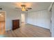 Comfortable main bedroom with laminate flooring, a ceiling fan, and ensuite bathroom at 205 Andover N Pl # 110, Sun City Center, FL 33573