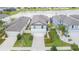 Aerial view of home shows lawn, lake in background and close proximity to neighbors at 20925 Monza Loop, Land O Lakes, FL 34638